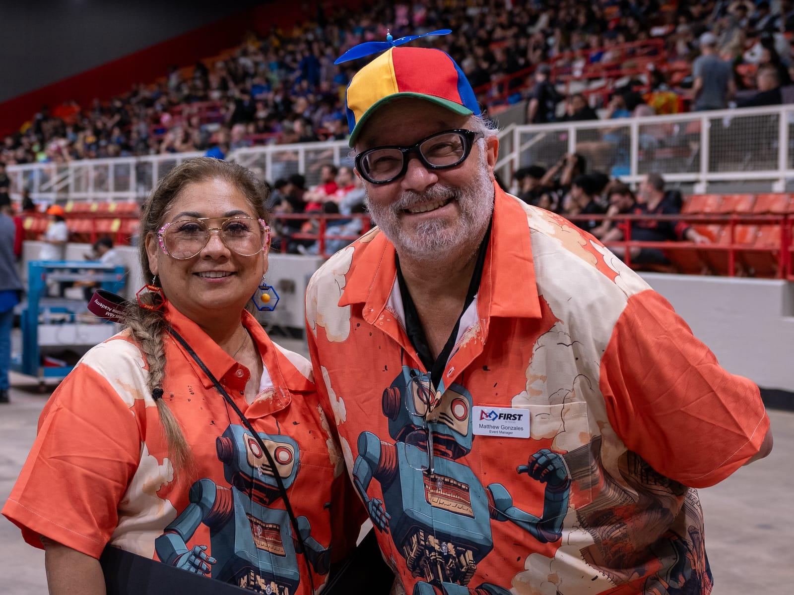 Two FIRST Texas volunteers in the field-crew uniform